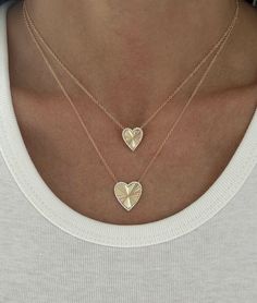 This gorgeous necklace features a small fluted heart with a pave diamond outline. 14K Yellow Gold Chain length with out heart: 14" + 1" + 1" Heart measurement: 11mm x 12mm 36 round diamonds 0.08ct 2.42 grams Luxury Heart Cut Necklace With Single Diamond, Luxury Classic Solitaire Heart Necklace, Luxury Classic Heart Solitaire Necklace, Diamond Outline, Necklace Combo, Diamond Heart Necklace, Heart Necklace Diamond, Yellow Gold Chain, Gorgeous Necklaces