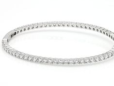 Bella Luce® white diamond simulant 9.85ctw round, rhodium over sterling silver bangle. Measures approximately 7.25-8" L x 0.13" W and has a box clasp closure. The diamond equivalent weight is 5.96ctw. Stackable White Gold Cubic Zirconia Diamond Bracelet, Stackable Cubic Zirconia Diamond Bracelet In White Gold, Stackable White Gold Bangle With Cubic Zirconia, Stackable White Gold Diamond Tennis Bracelet, Classic Round Bangle With Diamond Accents, Stackable White Gold Tennis Bracelet Fine Jewelry, Stackable White Gold Tennis Bracelet, Pave Set Cubic Zirconia Bangle, Cubic Zirconia Bangle With Pave Setting