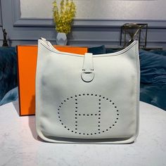 HM Evelyne III GM Bag White For Women 11.8in/30cm Hermes Evelyne Iii, Louis Vuitton Shirt, Hermes Kelly 28, H Design, Elegant Feminine, Togo Leather, Birkin 25, Luxury Products, Orange Leather