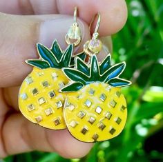 adorable big pineapple earrings * yellow and green enamel and gold pineapple charms  * elegant 14 karat gold fill ear wires * translucent yellow glass accent beads perfect gift for pineapple and tropical lovers! gold fill is very high quality and great for people with metal allergies. Handmade by me with Aloha in Hawaii they arrive ready for gifting with my LIVE ALOHA card, inside a delicate deep ocean blue organza bag. there is room on the card for your personal message as well! *to ensure safety in transit, earrings are now shipped inside a cute, reusable acrylic jar along with my Live Aloha card and organza bag* SEE MORE OF MY EARRINGS HERE: https://www.etsy.com/shop/LOphoto808?ref=br_feed_17&br_feed_tlp=art§ion_id=17783609 shipping additional items is FREE!! please contact me here: htt Fun Gold Summer Jewelry, Fun Gold Jewelry For Summer, Big Pineapple, Gifts For Young Women, Tropical Earrings, Tropical Jewelry, Pineapple Earrings, Gold Pineapple, Perfect Stocking Stuffers