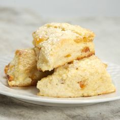 three biscuits stacked on top of each other on a white plate