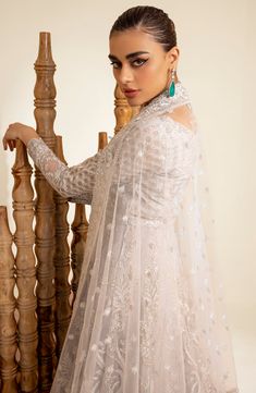 Elegant Silver Thorn Pakistani Wedding Dress Pishwas Frock Style is a breathtaking attire adorned with hand-crafted embellishments. Lavish designs and fine details of embroidery make this Pakistani Wedding Dress a breathtaking attire your foremost priority for the big day. Pishwas Frock: This Pishwas Frock is emblazoned with Lavish embroidery, motifs, sequins, and beads give a glamorous touch to the Pishwas Dress. Floral designs and shimmering silver details make this Pakistani Wedding Dress in Pakistani Boutique, Frock Style, Pakistani Wedding Dress, Gul Ahmed, Chiffon Collection, Embroidered Sleeves, Embroidered Dupatta, Embroidery Motifs, Pakistani Dress Design