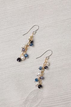 Experience the beauty and craftsmanship of the Seaside Collection with these gorgeous handmade earrings.    Mixed Metal (lead and nickel free) Kyanite, Iolite, Pearl 2", with sterling silver ear wires We hand select our natural materials, thus there may be slight variations in color and/or size that will not detract from the overall aesthetic Our unique handcrafted designer jewelry for women is made in America, with each design created individually in our personal design studio in Floyd VA USA Floyd Va, Silver Gold Earrings, Silver Gold Necklace, Pearl Design, Jewelry Lookbook, The Seaside, Cluster Earrings, Gold Collection, Made In America