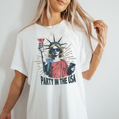 Hello! Party in the USA Shirt, Patriotic Shirt, 4th Of July Shirt, Independence Day, 1776 America, Statue of Liberty , Funny Fourth Of July Shirt The Unisex t-shirts are retail fit and a little bit relaxed. If you want to have a fitter look, I recommend you order one size smaller. But make sure you check our size-chart before you place your order. The inscriptions on the T-shirts are black in light colors and white in dark colors. So, here is a brief description for you to-see-the order-process: 1-) Please, Check and Review all Photos. 2-) Select Your T-Shirt Size and T-Shirt Color from drop-down menus. 3-) Choose Your Quantity as much as you want. 4-) Click ADD TO CART. You can go back to add more product color for your family members anytime you want, or you can complete the checkout pro Statue Of Liberty Funny, Independence Day 1776, Funny Fourth Of July, Hello Party, Bachelorette Party Tees, Bride Tee, Party In The Usa, Outdoor Bathroom, Fourth Of July Shirts