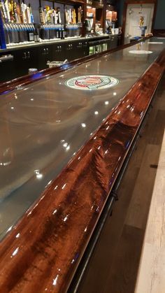 an empty bowling alley with wooden floors and shelves