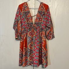 Nwt Boho Deep V Neck Dress Multi Color Paisley Print 3/4 Sleeves Elastic Empire Waist Tie Back Full Skirt 100% Polyester Unbranded Shoulder To Hem 34” Pit To Pit 21” Size L Stunning Colors! Beautiful! Bohemian V-neck Mini Dress With Vibrant Print, Multicolor Half Sleeve Dresses For The Beach, Flowy Orange Mini Dress For Vacation, Orange Half Sleeve Summer Dress, Flowy Orange Mini Dress For Beach, Bohemian Mini Dress With Colorful Pattern For Beach, Orange Short Sleeve Beachwear Dress, V-neck Mini Dress With Vibrant Print For Day Out, Orange Summer Dress With 3/4 Sleeve