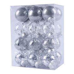 a clear box filled with silver and silver christmas bauble ornament balls