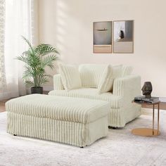 a white chair and ottoman in a room