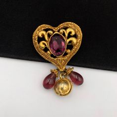 **** Please read and understand all ****100% Authentic Christian Lacroix Vintage Heart with Beaded Drop BroochHardware: Gold plated, Beaded, other Overall Condition: Good pre-owned condition. Includes: nothing Delivered with a jewellery box, not the original box.Measurements approximate: - L4 H7 cmCondition DescriptionsNew - Brand-new, not previously worn or owned. Undamaged and shows absolutely no signs of wear.Excellent - Previously owned, like new or lightly worn, with no signs of use and is Gold Heart-shaped Brooches For Gifts, Christian Lacroix Jewelry Vintage, Vintage Heart-shaped Brooch Jewelry, Vintage Yellow Gold Baroque Brooch, Antique Heart-shaped Brooches For Gifts, Chocker Necklace, Floral Necklace, Vintage Heart, Christian Lacroix