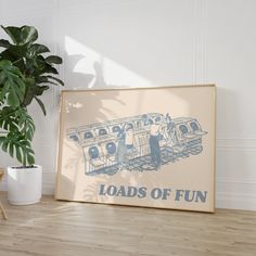 there is a sign that says loads of fun next to a potted plant on the floor