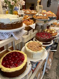 several cakes and pastries on display in a store