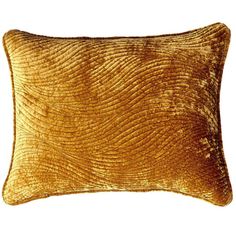 a gold velvet pillow on a white background