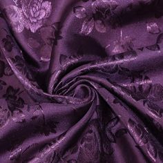 an image of purple fabric with flowers and leaves on it, as well as the background