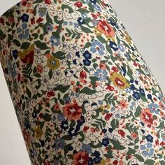 an image of a lamp shade with flowers on it