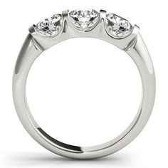 three stone engagement ring with four stones on the side, set in 18k white gold