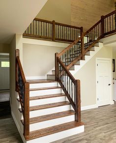 the stairs are made of wood and have metal railings