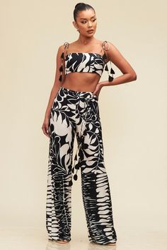 Two piece printed lightweight pant set with top with adjustable straps. No stretch. Pants run long. 100% polyester Chic Bold Print Summer Pants, Chic Black Printed Pants, Lightweight Pants, Black And White Print, Bold Black, End Of Summer, Pant Set, Stretch Pants, Selling Online