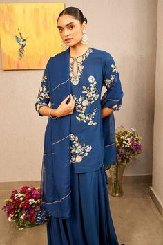 Blue kurta with thread embroidery in floral pattern. Paired with lehenga and dupatta. - Aza Fashions Royal Blue Semi-stitched Set For Eid, Unstitched Indigo Sets With Dupatta, Wedding Indigo Sets With Dupatta, Indigo Wedding Sets With Dupatta, Indigo Wedding Set With Dupatta, Blue Chanderi Bollywood Style Sets, Designer Blue Straight Kurta Sets, Blue Chanderi Lehenga For Eid, Bollywood Style Blue Chanderi Sets