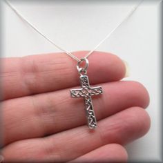 "A lovely sterling silver cross has the added interest of a scrollwork pattern added to the center sections. Wonderful for everyday wear for someone who wants a necklace of faith. The pendant is 1\" long (2.54 cm). The bail adds about 1/4\" more in length. Both pendant and curb chain are sterling silver. Items are shown larger in pictures to show detail - please note the dimensions. Jewelry is packaged in a cotton lined box for gift-giving. See more Bonny Jewelry at http://bonnyjewelry.etsy.com Sterling Silver Cross Pendant For First Communion, Silver Cross Pendant Jewelry For First Communion, Sterling Silver Cross Pendant Necklace For First Communion, Sterling Silver Cross Necklace For First Communion, Silver Cross Pendant Jewelry For Baptism, Silver Cross Jewelry For Confirmation, Sterling Silver Necklace For First Communion, Engraved Cross Jewelry For First Communion, Engraved Cross Necklace For First Communion