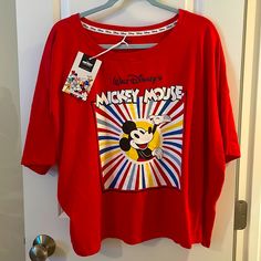 Nwt Disney Classic Mickey Mouse Colorburst Graphic T-Shirt Condition: All Are Brand New, Never Worn, With Original Tags. Description: Grab This Classic Disney Merch For A Much Better Price Than Retail And Rock This Adorable, Comfy, And Colorful, Old-School Mickey Tee With Pride. Features: Authentic, Licensed Disney Large Mickey Mouse Graphic Machine Washable Soft Cotton Polyblend Colors: Red With White/Blue/Red/Yellow Colorburst & Mickey Mouse Graphic In Center. Sizing: U.S. Women’s Large & Extr Fun Mickey Mouse Tops For Disney Fan Events, Multicolor Disney Crew Neck T-shirt, Multicolor Graphic Print Top For Disney Fan Events, Multicolor Mickey Mouse T-shirt For Disney Events, Fun Mickey Mouse Short Sleeve Tops, Graphic Tee For Disney Fan Events In Multicolor, Multicolor Graphic Tee For Disney Fan Events, Disney Graphic Print Short Sleeve Top, Disney Short Sleeve Top With Graphic Print