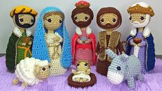 crocheted nativity scene with baby jesus, mary, joseph and the three wise men