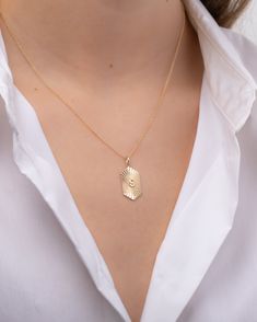 Beautifully handcrafted pleated shield with gold initial center, 14k solid gold, chic and timeless, hanging from a cable link chain. Wear it by itself or layered, day or night. Size: Approx. 22mm (H) x 12mm (W) Size of Initial: Approx. 5mm (H) x 3mm (W) Standard Production: 5 to 12 business days Rush Order Production: 3 to 6 business days Shipping: Select shipping method at checkout. Shipped from our L.A. Studio. This item is Final Sale. See here for details. Elegant Gold Stainless Steel Initial Necklace, Everyday Monogram Initial Pendant Name Necklace, Elegant Gold Monogram Name Necklace, Gold Monogram Name Necklace For Personalized Gift, Gold Square Pendant Initial Necklace, Tarnish Resistant, Gold Chic, Gold Initial, Initial Pendant, Chain Link Necklace