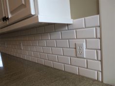 a kitchen counter top with a light switch on it