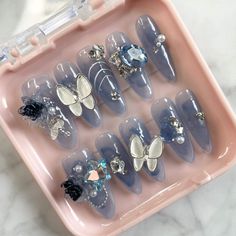 Step into a world of enchantment with these stunning fairy press-on nails adorned with delicate butterflies and vibrant flowers! 🌸✨ Elevate your everyday look or add a touch of magic to a special occasion with these beautifully designed nails that are sure to make heads turn. Embrace the whimsy and unleash your inner fairy today! #FairyNails #ButterflyNailArt #FloralFantasy 3d Charms For Nails, Moon Nail Charms, Zodiac Nail Charms, Gothic Nail Charms, Gyaru Press On Nails, Blue Prom Nails, Wedding Day Nails