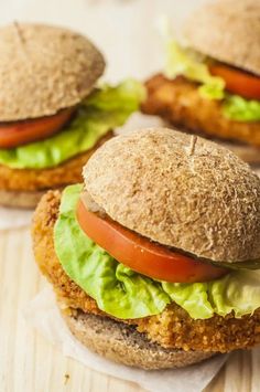 chicken sandwich with lettuce and tomato on top