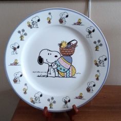 a white plate with a snoopy dog on it