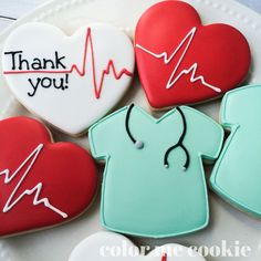 cookies decorated to look like doctors and heartbeats