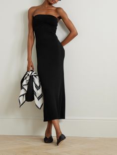 TOVE's 'Cate' midi dress will take you from relaxed vacation dinners to cocktail parties in the city. It's cut from jersey with plenty of stretch and has a strapless silhouette with a twist front - a label signature. Style yours with strappy sandals and sculptural silver jewelry. Casual Ruched Maxi Dress For Evening, Sleek Summer Evening Maxi Dress, Flattering Black Maxi Dress For Summer, Flattering Summer Formal Midi Dress, Summer Cocktail Midi Dress With Flattering Style, Sleek Summer Midi Dress With Ruched Detail, Flattering Summer Maxi Dress For Date Night, Sleek Midi Dress For Summer Date Night, Flattering Ruched Summer Maxi Dress