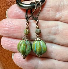 Czech glass pumpkin earrings -  Green Pumpkin/Melon Earrings I've paired them with antiqued copper to give them a warm autumn feel.  The earrings are 1 1/2 inches long and come in a gift box. Pierced Czech Glass Drop Earrings, Pierced Green Copper Earrings, Green Copper Pierced Earrings, Unique Czech Glass Earrings With Ear Wire, Hypoallergenic Czech Glass Round Earrings, Hypoallergenic Round Czech Glass Earrings, Green Copper Earrings With Ear Wire, Green Copper Earrings, Nickel-free Czech Glass Drop Earrings