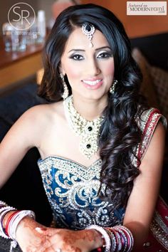 an image of a woman with henna on her face and in front of the camera