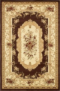 a brown and white rug with an ornate border on the center, surrounded by flowers