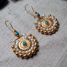 Wonderful modern pair of 15ct Gold hallmarked (585) Etruscan Revival Earrings with Seed pearl & Turquoise cabochon. Very similar to Indian designs. Dimensions: 4.5 cm long, 2.7 cm wide, 6g in weight. Turquoise Temple Jewelry Earrings As Gift, Turquoise Temple Jewelry Earrings For Gift, Festive Round Turquoise Earrings, Turquoise Temple Jewelry Earrings, Traditional Oval Cabochon Earrings, Festive Turquoise Round Earrings, Antique Turquoise Earrings, Turquoise Round Hallmarked Earrings, Etruscan Jewelry Earrings