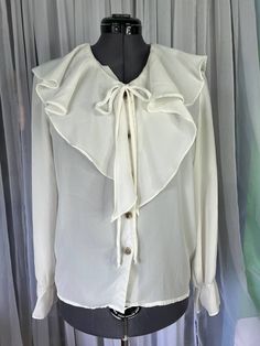 Blouse button up sheer oversized ruffle collar size Small Be aware that vintage sizes may vary from modern standard sizes. See the sizely chart in the product photos for full measurements. The measurements are the most accurate gauge of the garments size. chest, waist and hip measurements are taken laying flat and then doubled. all measurements are approximate.  Vintage items are carefully inspected and I do my best to describe all flaws. but all vintage items may have unnoticed flaws and signs Ruffle Collar, House Dress, Vintage Lingerie, Pocket Dress, Product Photos, Embroidered Top, Design Inspo, Lingerie Set, Womens Clothing Tops