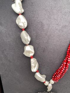 AD Blue Stone Black Stone Detachable Pendent Red Beads Mother Of Pearls MalaColor : SilverSize : Necklace Length : 24 InchesStones : Red Beads CZ Pearls Blue Stone Black Stone Pearls Mala, Pearl Mala, Fashion Beads, Red Beads, Traditional Fashion, Mother Pearl, Red Bead, Beads Necklace, Black Stone