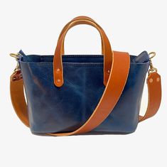 The Bella Crossbody Bag in Blue: Elegant, Durable, and Handcrafted Introducing The Bella Crossbody Bag—a stunning piece of craftsmanship, expertly made from one of the strongest leathers in the world: glazed full-grain water buffalo leather. Known for its incredible strength and unique pull-up effect, this leather develops a dazzling patina over time, making your bag truly one of a kind. Not only is buffalo leather extremely durable, but it is also highly resistant to weather and tearing, ensuri Blue Rectangular Leather Shoulder Bag, Blue Leather Tote Shoulder Bag, Blue Leather Satchel Shoulder Bag, Blue Leather Shoulder Bag, Luxury Blue Shoulder Bag For Everyday Use, Blue Leather Bag For Daily Use, Rectangular Blue Shoulder Bag With Leather Lining, Blue Leather Bags With Soft Leather, Blue Leather Shoulder Bag With Leather Lining