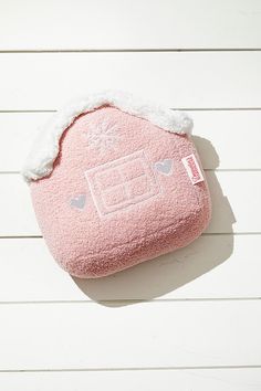 a pink case sitting on top of a white wall