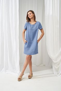 "A classic, fitted design shirt dress that is super comfy and stylish at the same time. Tailored with short sleeves, made from Lithuanian washed linen fabric. Feels silky soft on the skin and is a nice item to pair with both sandals and sneakers. FABRIC: 100% Softened Lithuanian Linen COLOR: Please choose the desired color from the side menu. STYLE: Loose linen T-shirt dress with short sleeves, fold at the back, and side pockets. SIZE CHART: 2 US/ 6 AU/ 34 EU: Bust 31.5\" (80 cm) , Waist 23\" (5 Casual Short Sleeve Summer Dress For Work, Relaxed Fit Short Sleeve Dress, Casual Blue Linen Dress For Work, Relaxed Fit Knee-length Short Sleeve Dress For Daywear, Knee-length Daywear Dresses With Rolled Sleeves, Relaxed Fit Short Sleeve Work Dresses, Casual T-shirt Dress For Summer Workwear, Knee-length Dresses With Rolled Sleeves For Daywear, Summer Linen Shift Dress With Short Sleeves