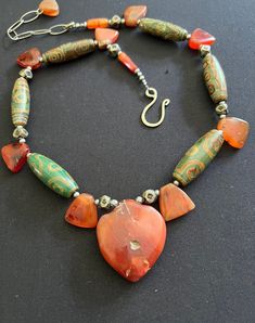 Excited to share this item from my #etsy shop: Idar Oberstein old carnelian trade beads & Carnelian ancient arrows with green agate Dzi eye collectible African handmade necklace. Eye Green, Exotic Jewelry, Arrow Pendant, African Trade Beads, Unusual Jewelry, Textile Jewelry, Green Agate, Trade Beads, Rock Crystal