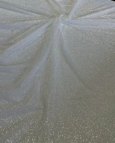 an umbrella covered in silver glitter fabric