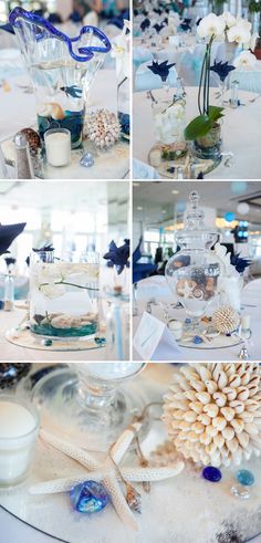 the table is decorated with blue and white flowers, seashells and other items