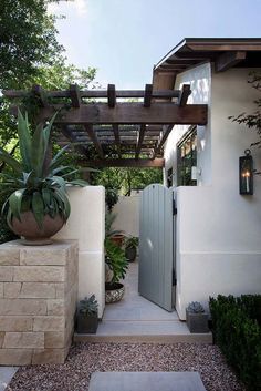 an entrance to a home with stone steps leading up to it