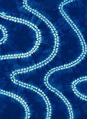 a blue background with white swirls in the shape of circles and lines on it