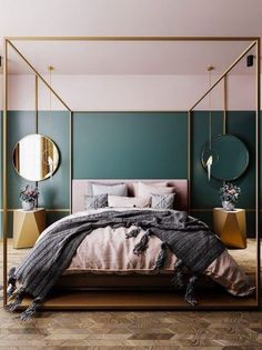 a bedroom with green walls, gold accents and a canopy bed in the middle of it