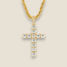 Indulge in the luxurious embrace of faith with Jewels Essence's Diamond Cross Pendant Necklace, a timeless testament to grace and elegance. This exquisite piece features a resplendent cross pendant, meticulously adorned with the finest round-cut diamonds, each one precision-set to capture and reflect every glimmer of light. Crafted in lustrous gold, the pendant suspends gracefully from a classic rope chain, promising to lay beautifully against your skin. The radiant 18-carat gold hue accentuates the sparkle of the diamonds, creating a harmonious symphony of warmth and brilliance. This necklace is not just an accessory; it is a statement of devotion, an heirloom in the making, waiting to be passed down through generations. It embodies Jewels Essence's commitment to crafting jewelry that res Yellow Gold Crucifix Jewelry With Cubic Zirconia, Yellow Gold Cubic Zirconia Crucifix Jewelry, Luxury Diamond White Cross Pendant Necklace, Yellow Gold Cubic Zirconia Cross Necklace, Diamond Cut Cubic Zirconia Cross Necklace, Diamond White Cross Pendant Jewelry, Diamond White Cross-shaped Diamond Jewelry, Luxury Diamond White Cross Necklace, Diamond White Cross Jewelry With Prong Setting