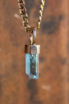 Discover the exceptional beauty of this dainty, intensely blue Aquamarine pendant, featuring a perfectly terminated specimen sourced from Vietnam, known for its high-quality crystals. Set in a rustic 14k yellow gold bezel cap and bale, this pendant is meticulously crafted to showcase the natural elegance of the gemstone. Aquamarine is revered for its metaphysical properties, believed to promote clarity, calmness, and harmony. This pendant is handmade with a hand-filed finish, ensuring a unique i Yellow Gold Aquamarine Pendant Jewelry, Aquamarine Pendant, Aquamarine Crystal, Tucson Arizona, Rare Gemstones, Aquamarine Blue, Yellow Gold Pendants, Intense Colors, Lovely Colors