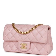 This Camellia Crush Mini Rectangular Flap bag is in Rose Clair lambskin leather with antique gold tone hardware and features a front flap with CC turnlock closure, back half moon pocket and adjustable interwoven antique gold tone chain link shoulder/crossbody strap with camellia flower attachment. The interior is lined in Rose Clair leather and features a small zip pocket with Chanel pull and slip pocket underneath on the rear wall. Collection: 23S (RFID Chip) Origin: Italy Condition: Pristine; Chanel Camellia, Chanel 19, Chanel Box, Chain Top, Chanel Mini, Camellia Flower, Pink Chanel, Pink Fabric, Chain Bags